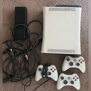 Xbox 360 with three controllers and lot of games